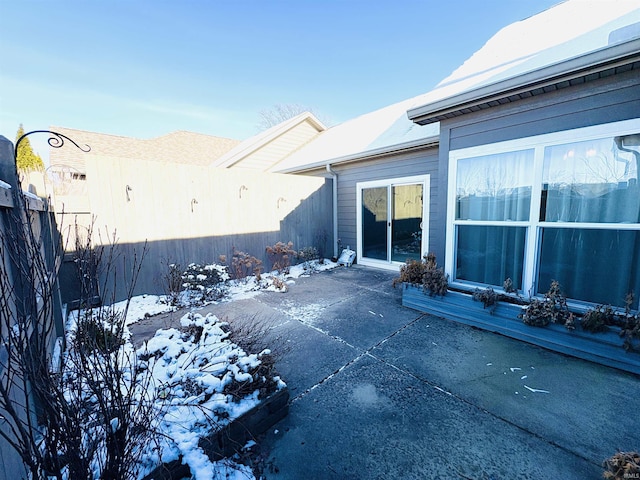 view of snow covered patio