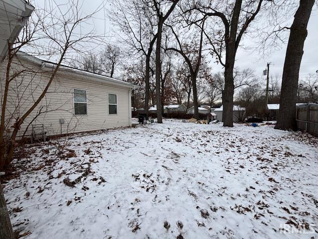 view of yard covered in snow