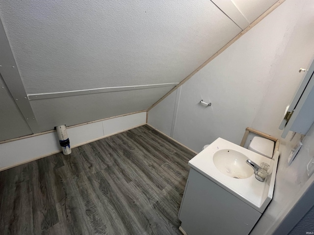 bathroom featuring vanity and hardwood / wood-style flooring