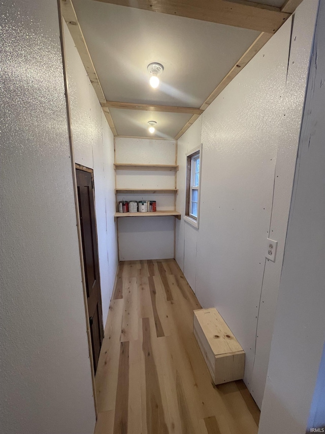 hallway with light hardwood / wood-style flooring