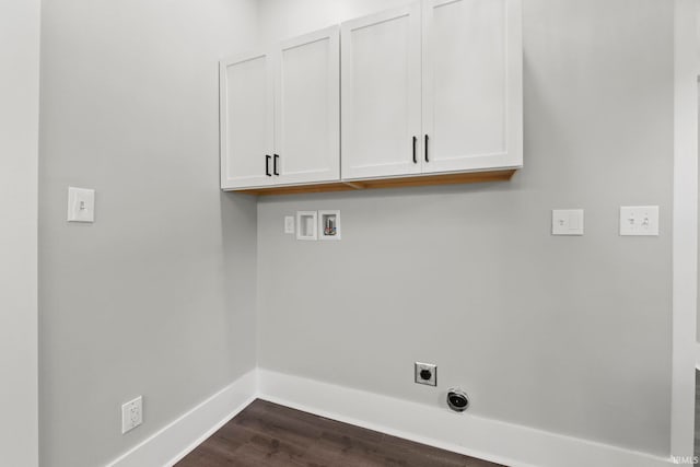 clothes washing area featuring hookup for an electric dryer, cabinets, dark wood-type flooring, and hookup for a washing machine