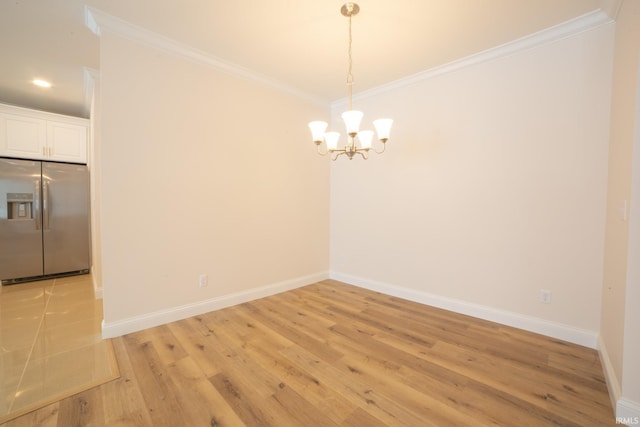 unfurnished room featuring light hardwood / wood-style floors and crown molding