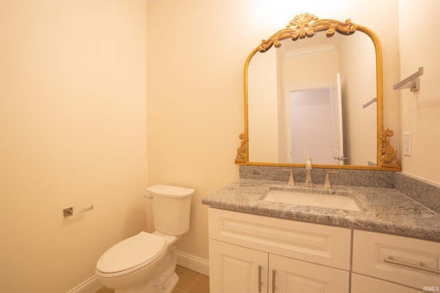 bathroom featuring tile patterned floors, vanity, and toilet