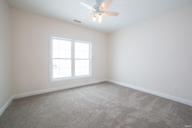 empty room with carpet and ceiling fan