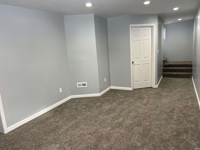 basement with dark carpet