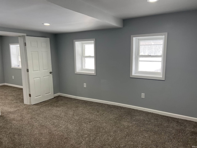 carpeted empty room with a wealth of natural light