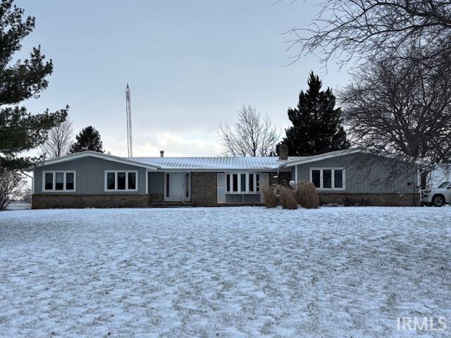 ranch-style house with a chimney