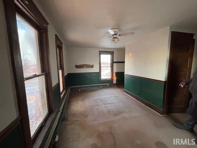 unfurnished room featuring ceiling fan