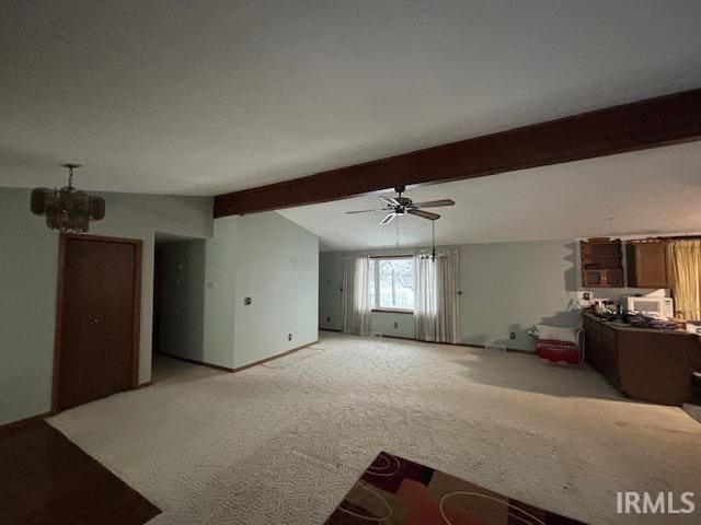 unfurnished living room with lofted ceiling with beams, light colored carpet, and ceiling fan with notable chandelier