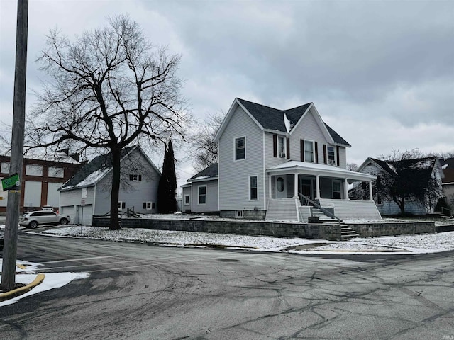 view of front of house with a porch and a garage