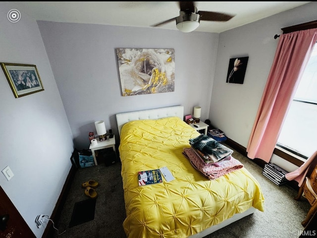 bedroom featuring carpet flooring, multiple windows, and ceiling fan