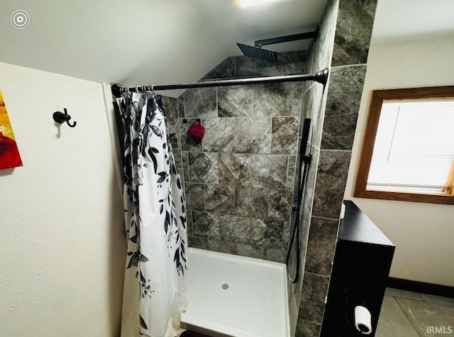 bathroom featuring curtained shower