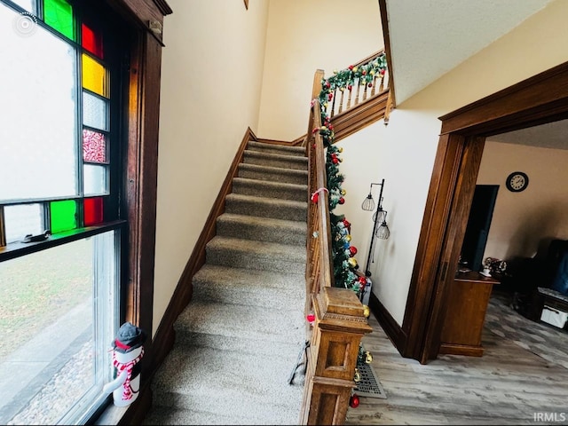 staircase featuring hardwood / wood-style flooring