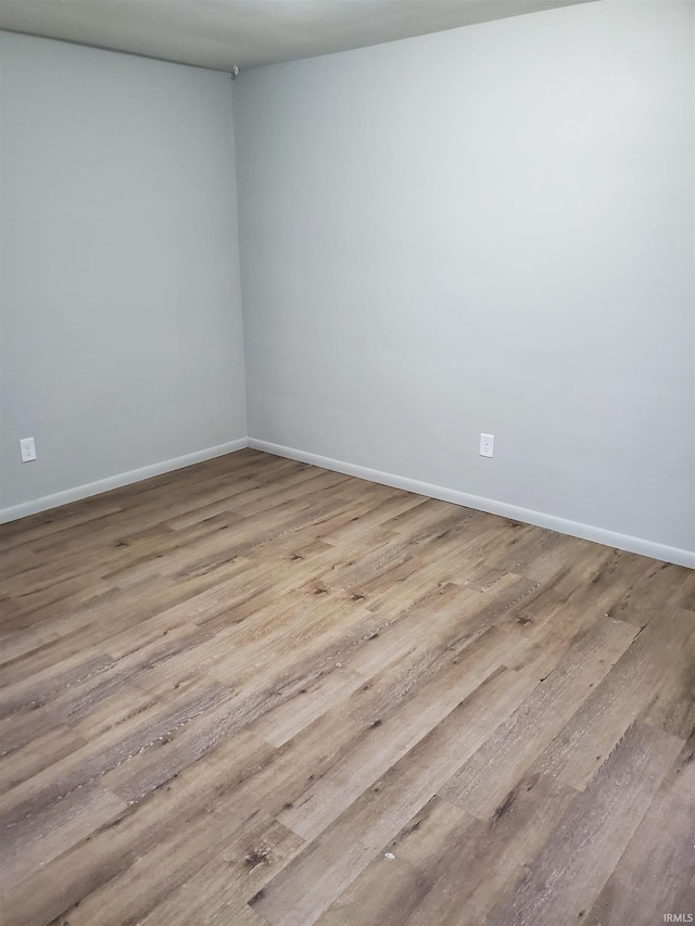 empty room with light wood-type flooring