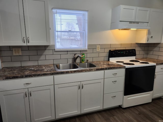 kitchen with electric range, white cabinets, sink, and tasteful backsplash