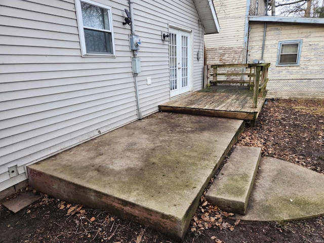 view of patio / terrace featuring a wooden deck and french doors