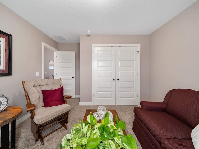 sitting room with carpet flooring