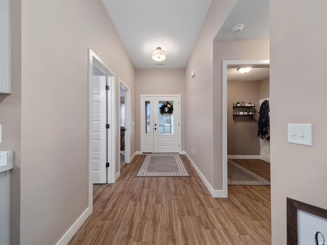 doorway to outside featuring light wood-type flooring