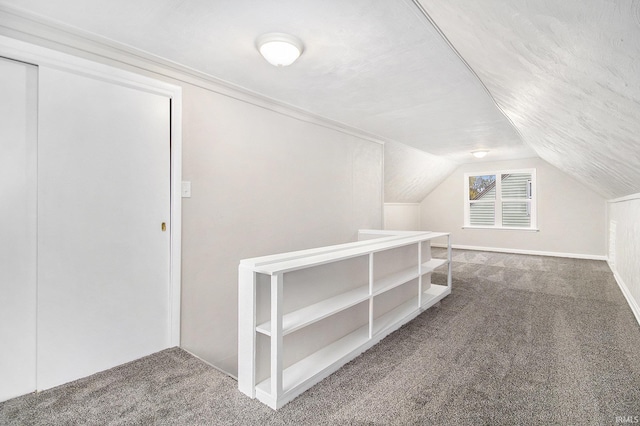 bonus room featuring carpet flooring and lofted ceiling