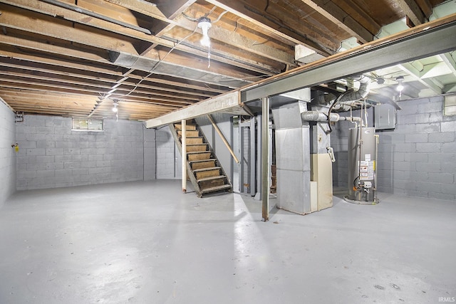 basement featuring gas water heater and heating unit