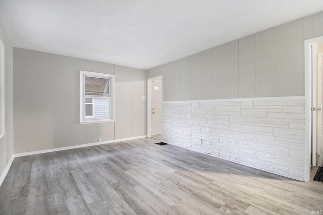 spare room with light wood-type flooring