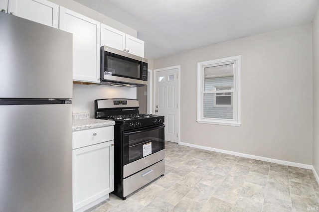 kitchen featuring white cabinetry and stainless steel appliances