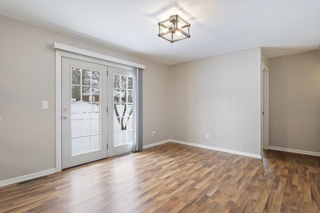 spare room featuring dark wood-type flooring