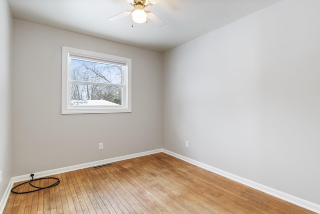 spare room featuring ceiling fan and light hardwood / wood-style floors