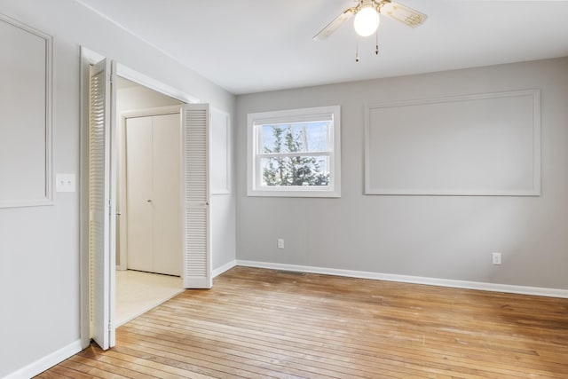 unfurnished bedroom with ceiling fan and light hardwood / wood-style floors