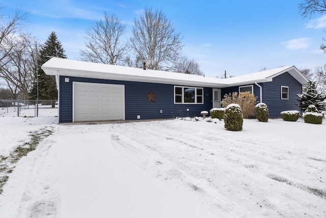 ranch-style house featuring a garage