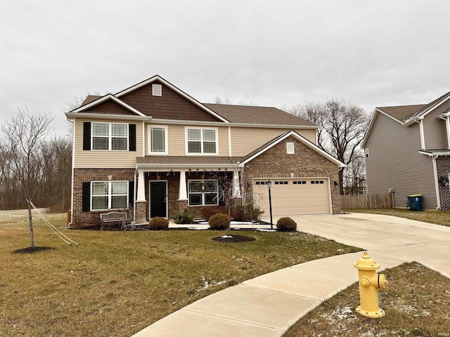 craftsman house with a garage and a front lawn