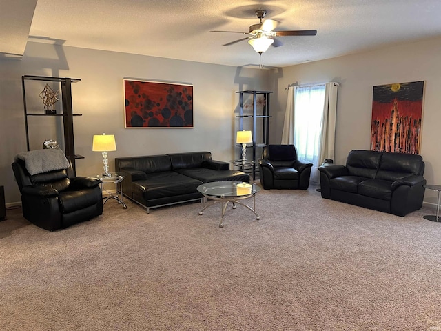 carpeted living room with ceiling fan and a textured ceiling