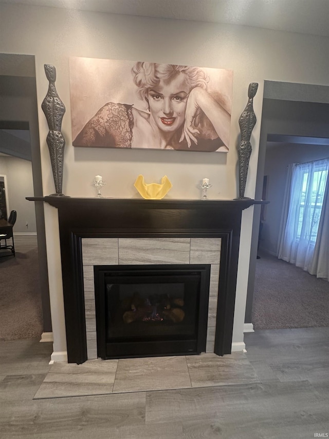 room details featuring a fireplace and hardwood / wood-style floors