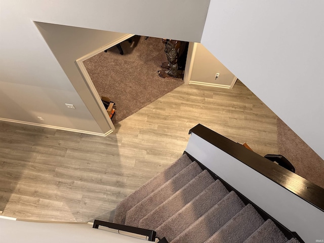 stairway featuring hardwood / wood-style floors