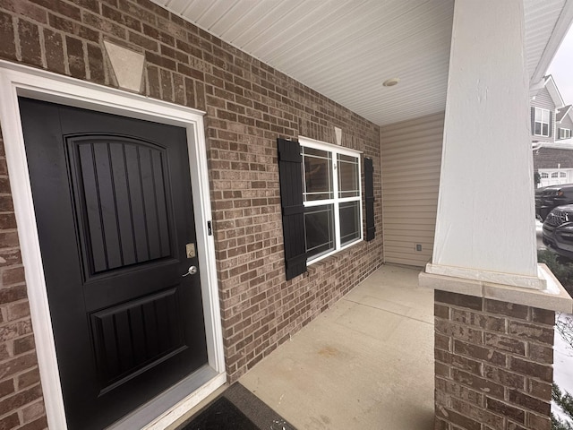 property entrance featuring covered porch