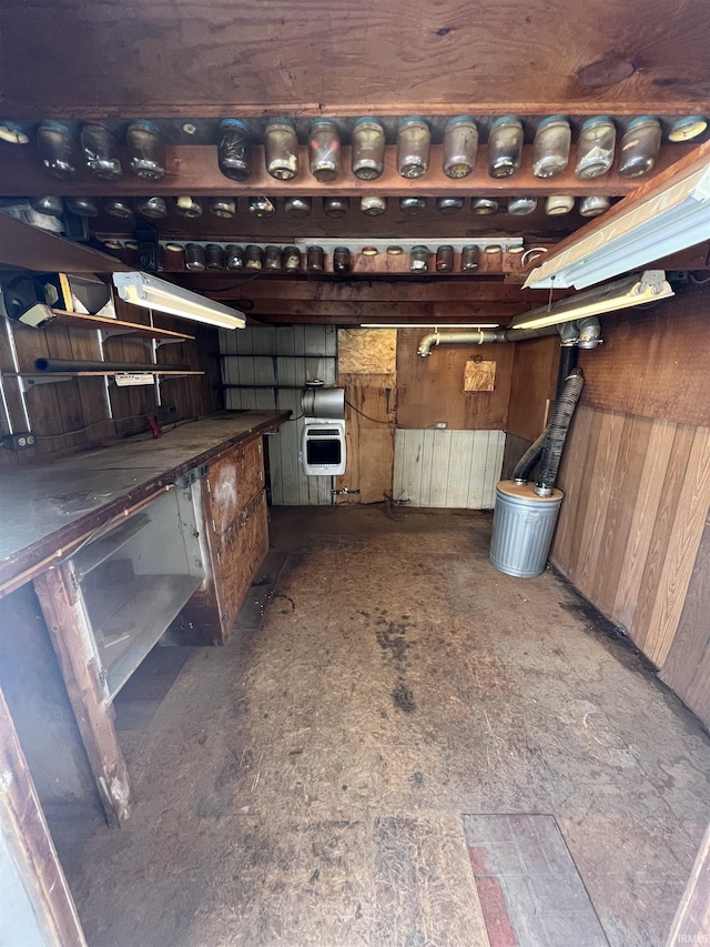 interior space featuring wood walls and heating unit