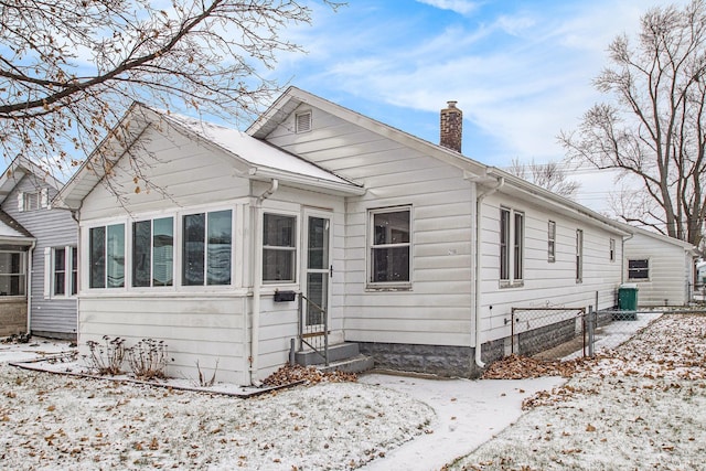 view of front of home with a sunroom