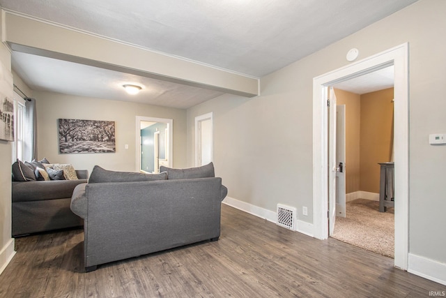 living room with dark hardwood / wood-style flooring