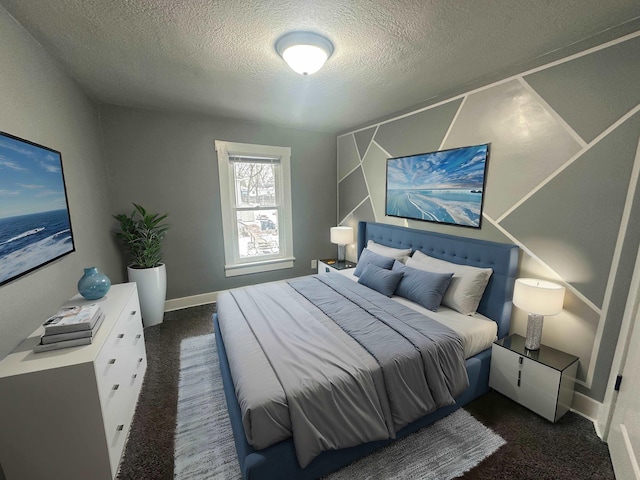 carpeted bedroom with a textured ceiling