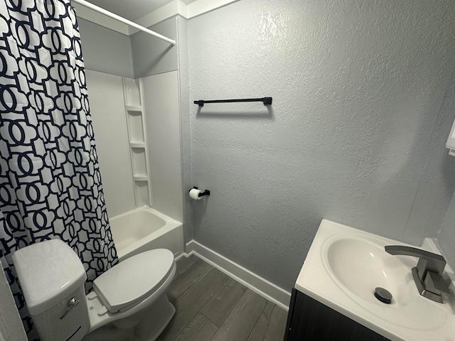 full bathroom featuring vanity, shower / tub combo, and toilet