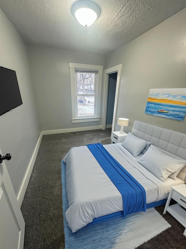 carpeted bedroom with a textured ceiling