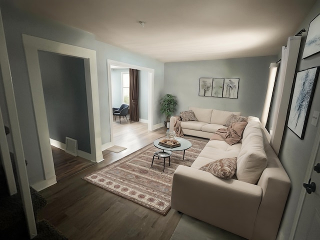 living room featuring dark wood-type flooring