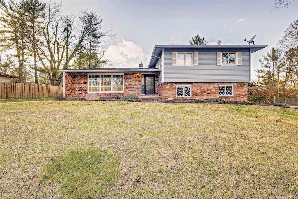 tri-level home featuring a front yard