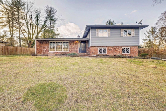 tri-level home featuring a front yard