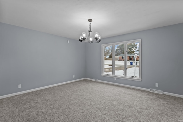 unfurnished room featuring carpet flooring and a notable chandelier