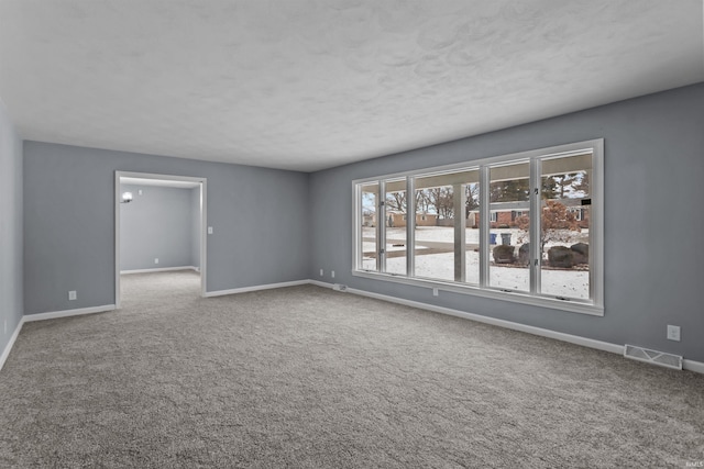 unfurnished room with carpet flooring