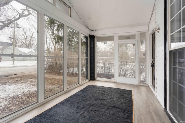 unfurnished sunroom with vaulted ceiling