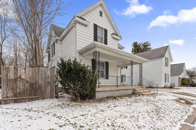 view of front property featuring covered porch