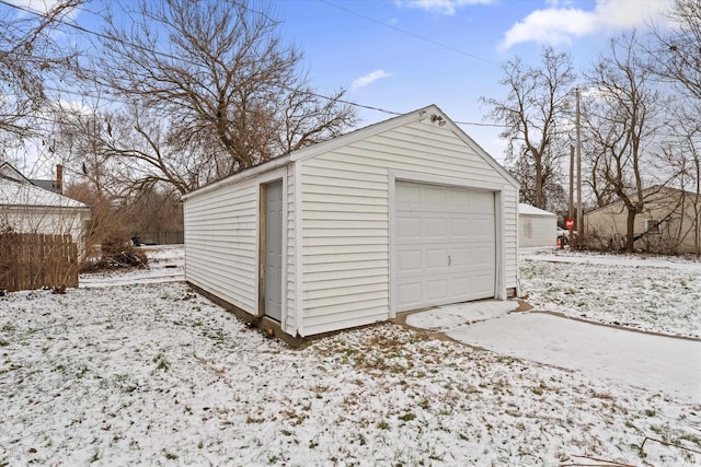 view of snow covered garage