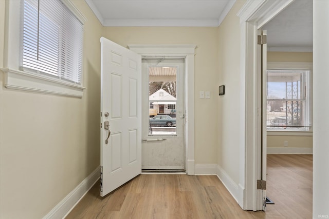 interior space featuring light wood-type flooring and ornamental molding